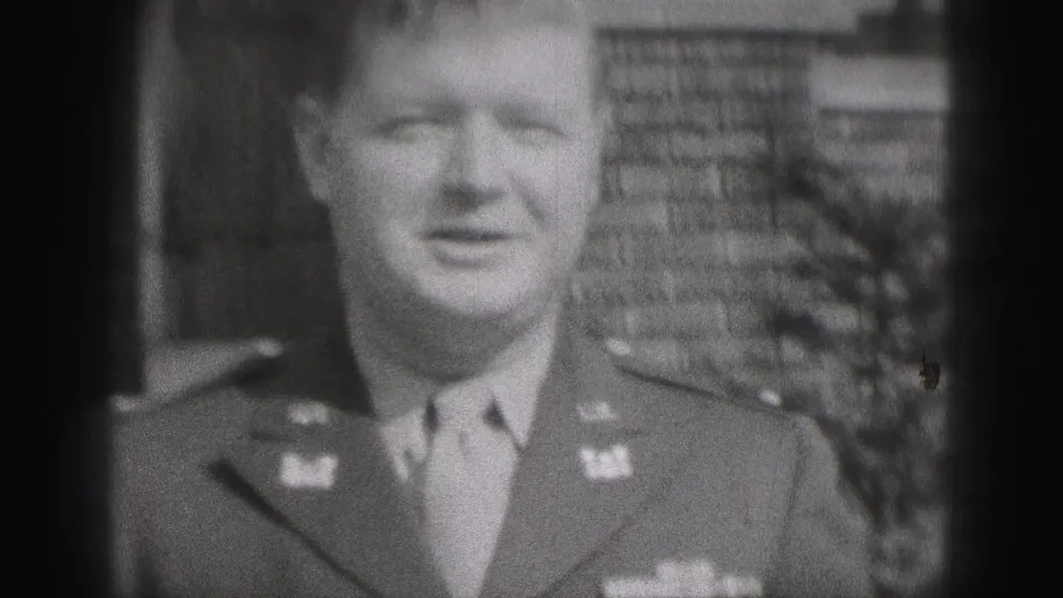 In New Cumberland, Pennsylvania, a uniformed man smiles toward the camera in a soft black-and-white 1946 home-movie frame.