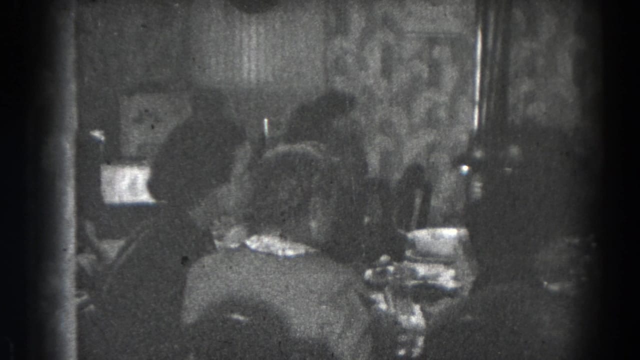 Family meal scene in a Lincoln, Nebraska home, with several people seated closely around the table.