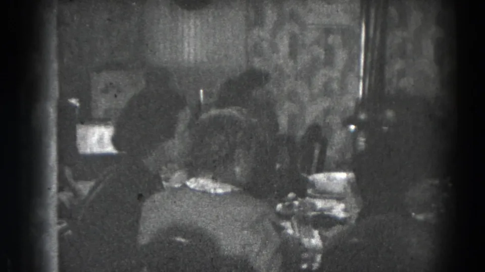 Family meal scene in a Lincoln, Nebraska home, with several people seated closely around the table.