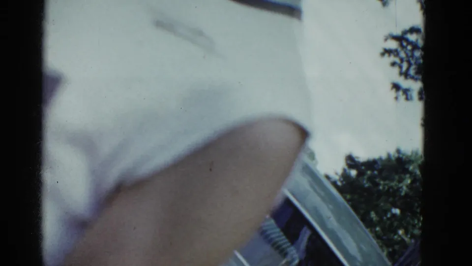 The final frame is mostly obscured by a nearby person or hand, with a small patch of trees and sky at the side.
