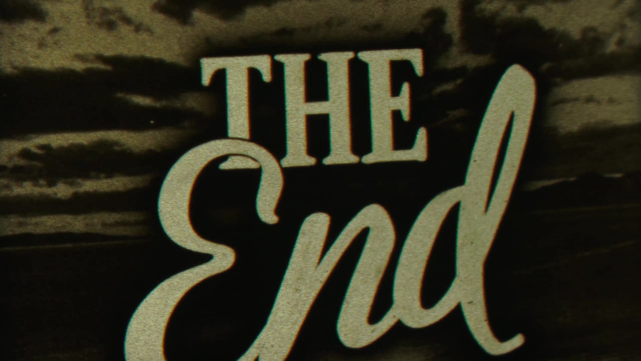 1958 Cheyenne County home-movie frame with THE END lettering in bold script against a dark background.