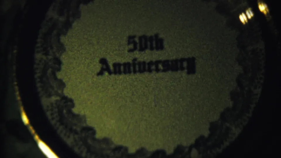 Close 8mm view of the 50th Anniversary wording and decorative border from the 1958 Saint Francis, Kansas clip.