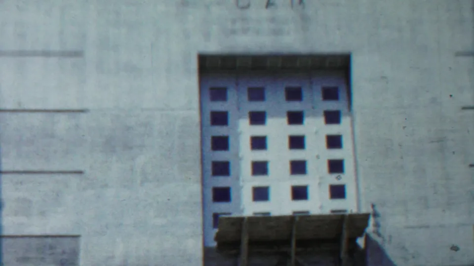 1959 Kansas frame showing the gridded Tuttle Creek Dam gate within the concrete structure, with lettering faintly above.