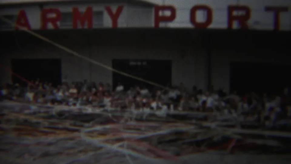 1954 Yokohama Army Port facade seen through windblown streamers, with spectators gathered near dark doorways.