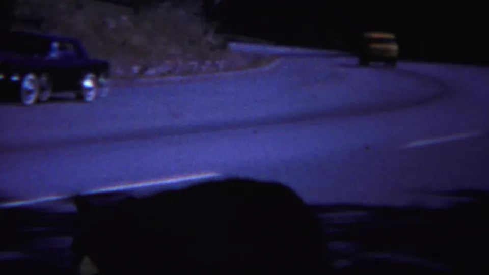 A 1967 Yellowstone road scene shows classic cars passing while a bear appears as a dark shape near the lower frame.