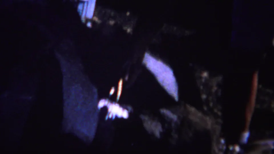 1967 8mm Yellowstone footage begins with a dark, handheld view before the Old Faithful geyser scene becomes clear.
