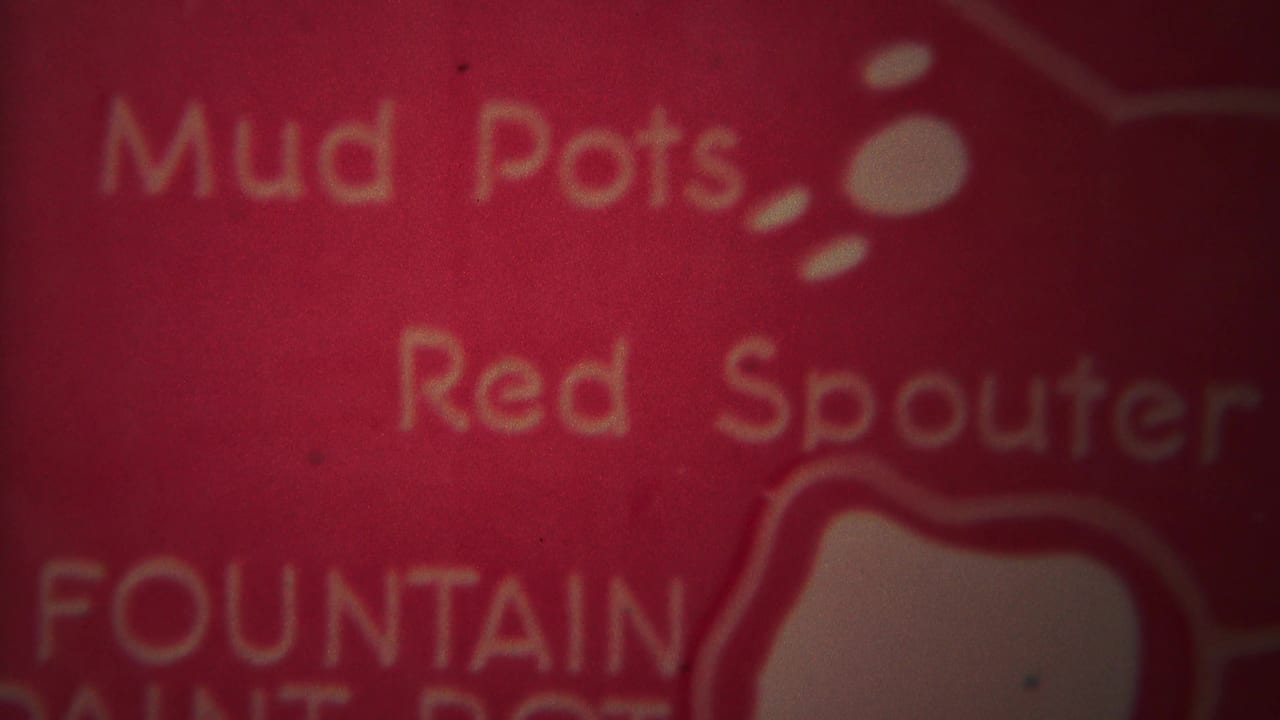 Red title-like frame with white words including Mud Pots and Red Spouter.