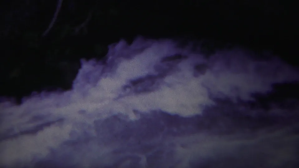 1967 Yellowstone 8mm frame showing turbulent white water moving through a dark, shadowed river channel.