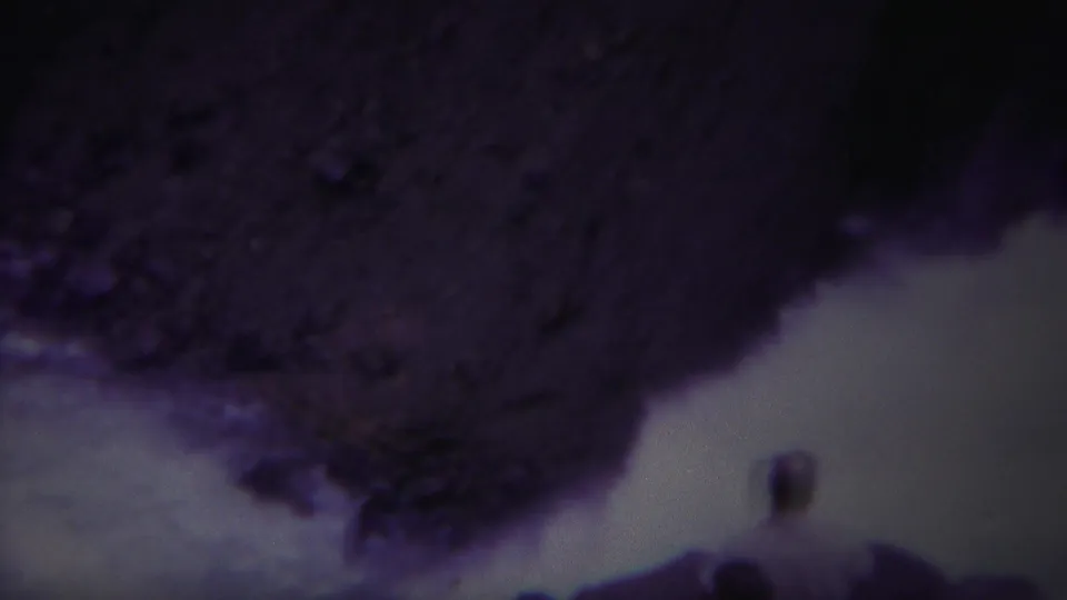 1967 8mm Yellowstone footage appears to show whitewater moving through dark rock, with purple fading and a handheld downward angle.