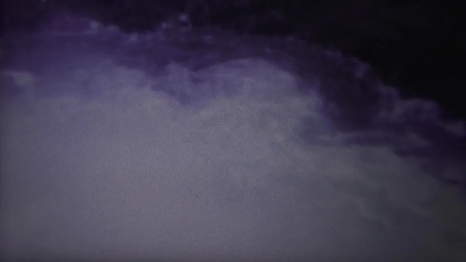 Final 1967 8mm Yellowstone, Wyoming frame showing churning pale water against a dark purple-blue shadowed area.