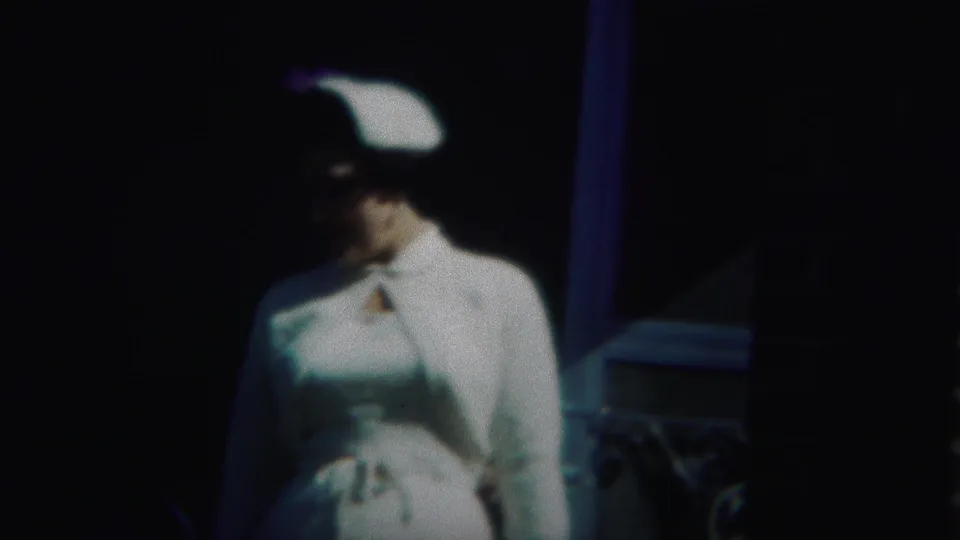 At the end of the 1951 Westville shot, the woman turns in profile, with her white hat and dress standing out against the shadows.