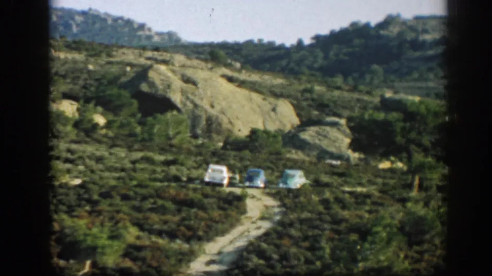 The closing frame shows three cars on a dirt road below pale slopes in the Ephesus, Turkey travel footage.