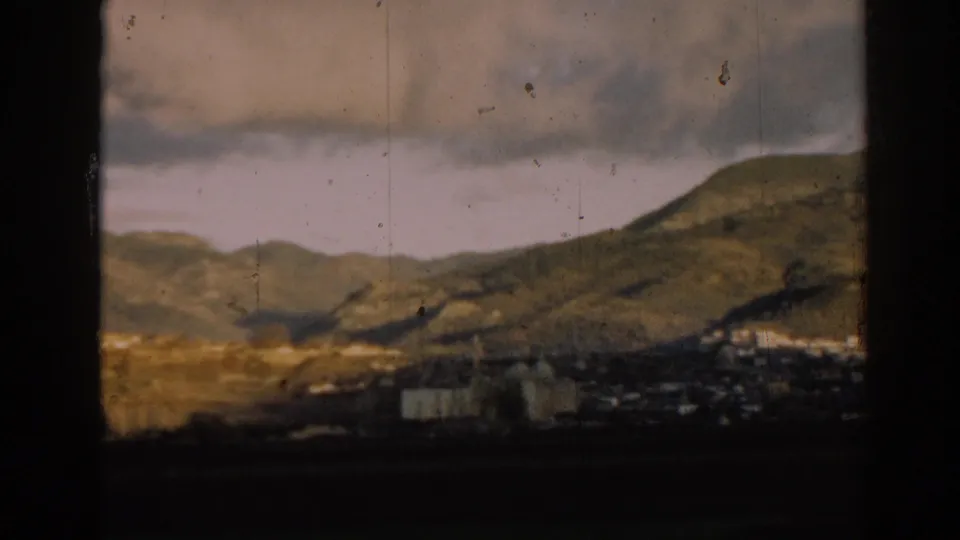 The pan continues across hills near Ephesus, with small light-colored buildings visible in the valley below.