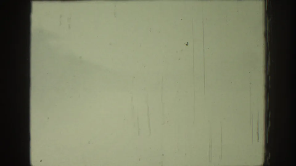 Overexposed 8mm frame from the 1962 Rhodes reel with a horizontal splice-like line, scratches, dust, and heavy fading.