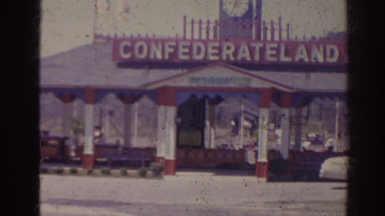 Confederateland entrance sign above a red-and-white ticket booth.