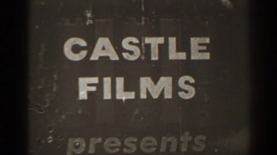 Dark, worn title-card frame with large Castle Films presents lettering and visible scratches.