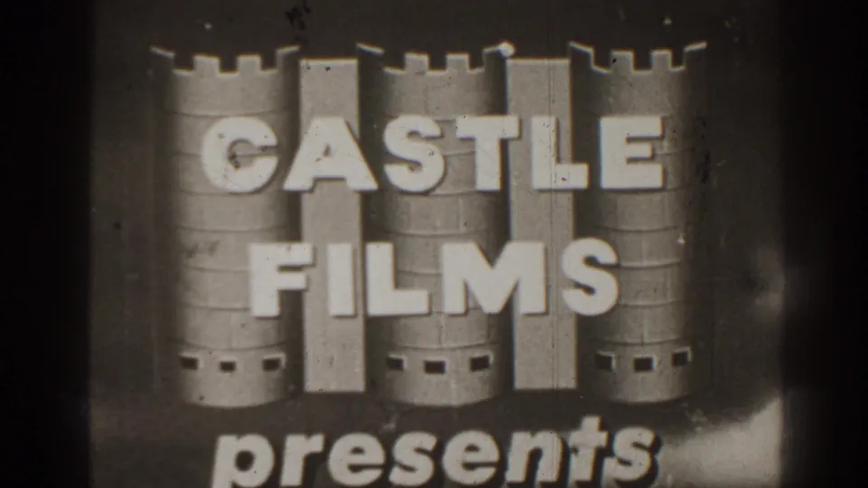 Castle Films presents title card with a castle graphic, bold lettering, soft focus, and dark film edges.