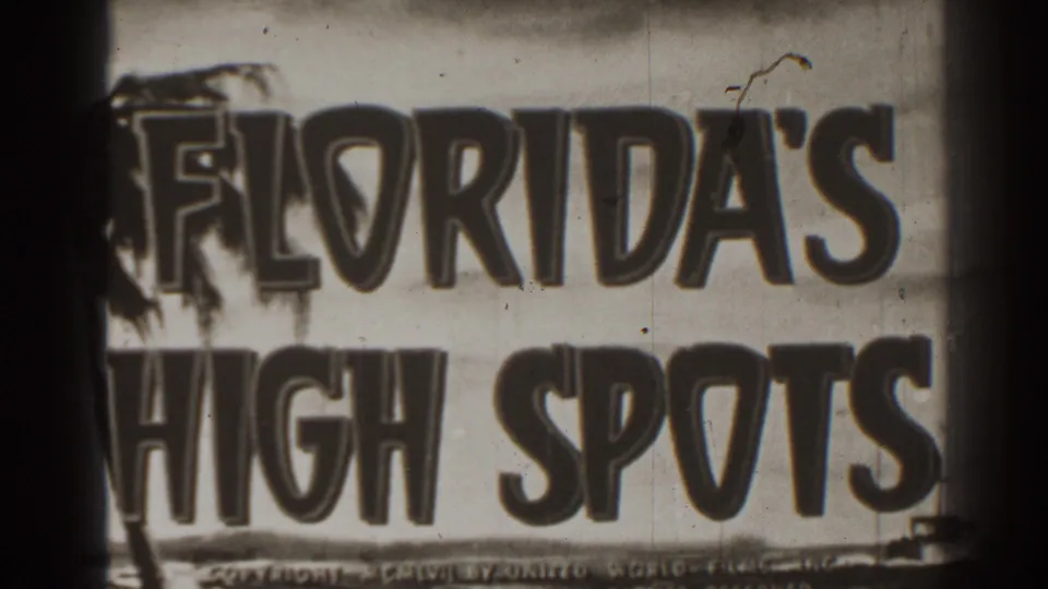 Close black-and-white 8mm view of the Florida's High Spots title card, cropped across the large words with dust and scratches visible.