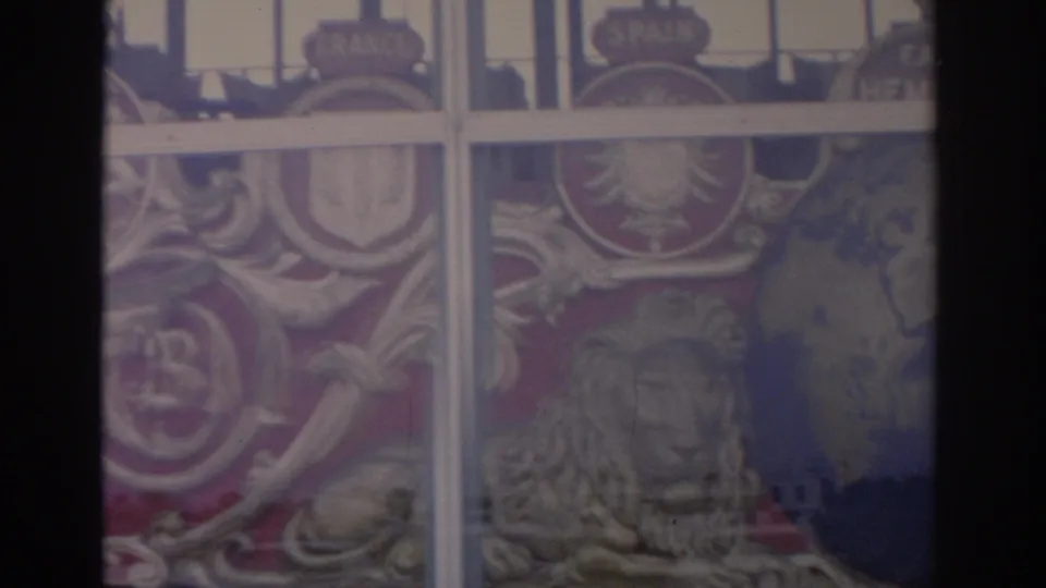 1962 Florida frame with white pane dividers crossing painted heraldic symbols, including a crest, winged figure, and lion detail.