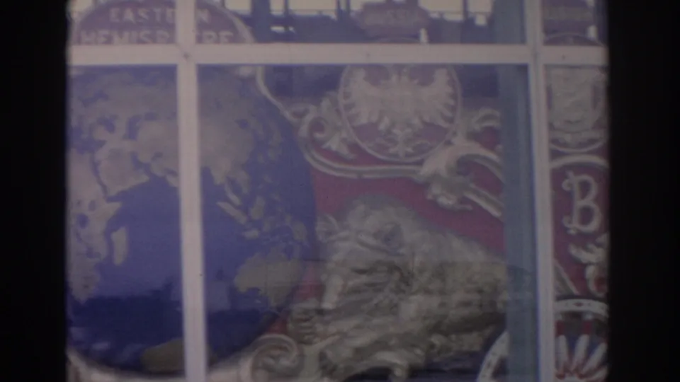 1962 Florida frame with a heraldic lion, red shield area, winged ornament, and window mullions crossing the painted display.
