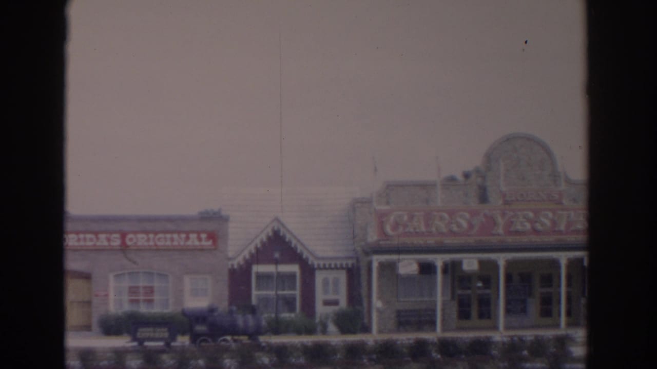 Storefront row with Florida's Original sign and Cars of Yesterday museum facade.