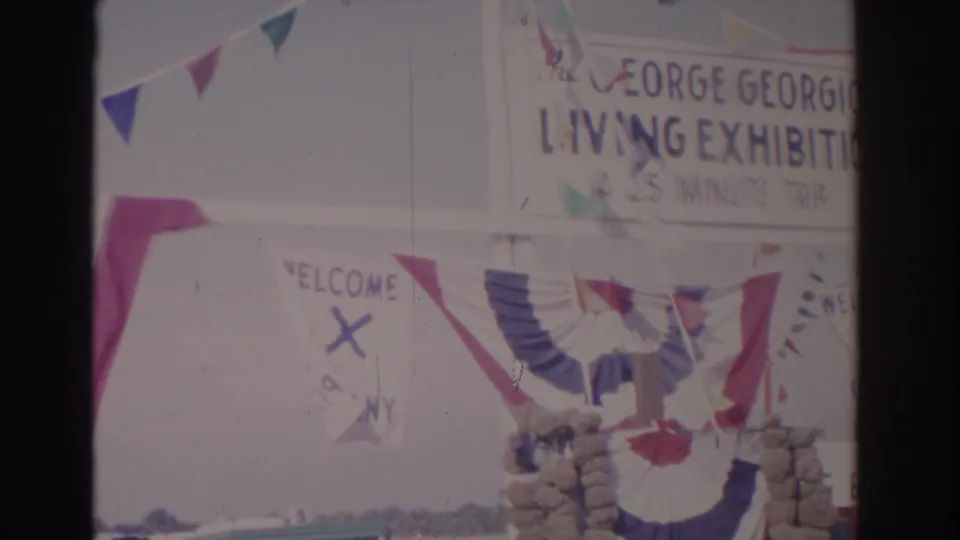 Decorated entrance to the Florida diving exhibition, with welcome banner, patriotic fabric, and the 25-minute trip sign partly visible.