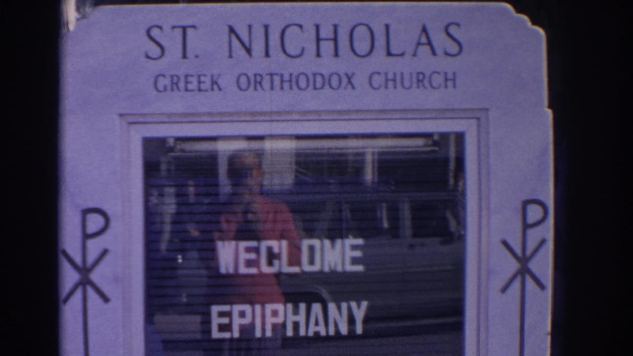 St. Nicholas Greek Orthodox Church sign with welcome epiphany lettering in the window.