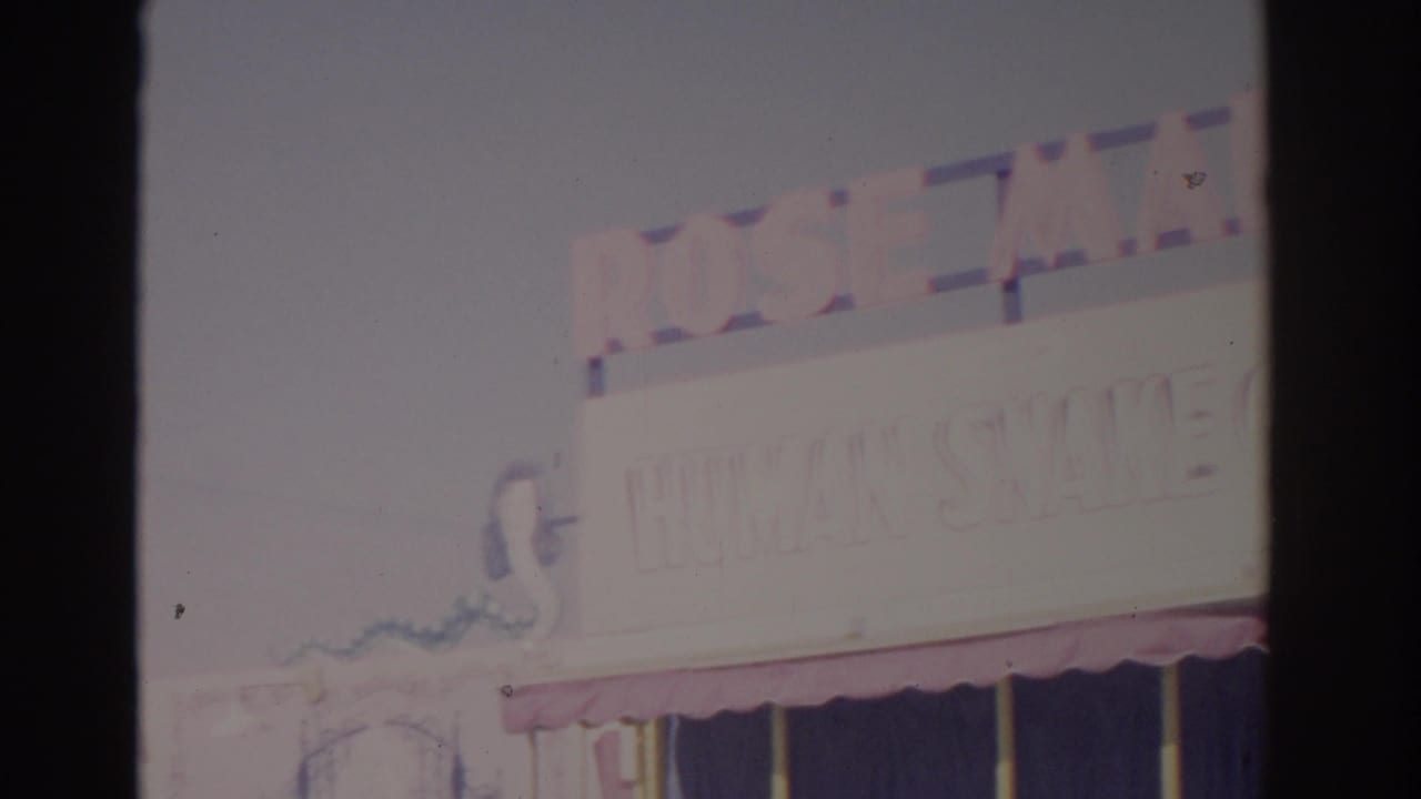 A bright final frame shows partial amusement signage, an awning, and washed-out sky in the same 1962 Florida fair footage.