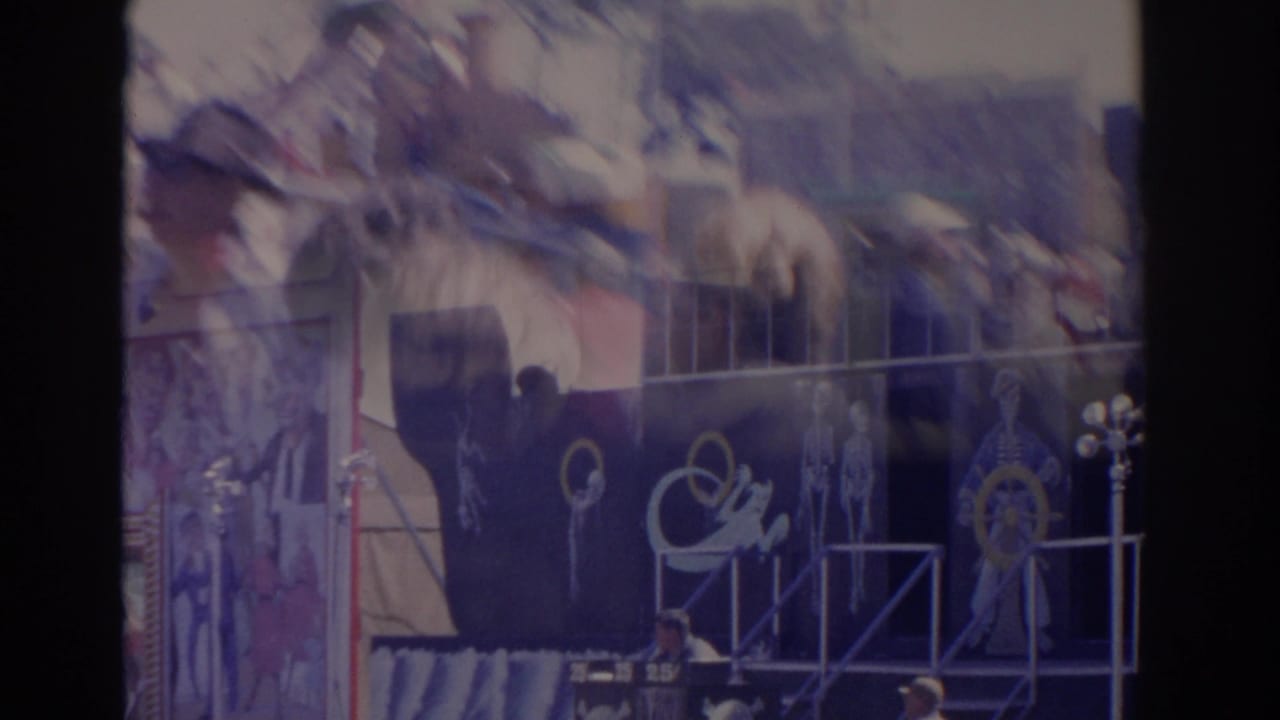 Dark blue Ghost Ship carnival ride facade in Florida, with painted skeletal figures, railings and nautical decoration.