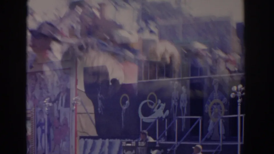 Dark blue Ghost Ship carnival ride facade in Florida, with painted skeletal figures, railings and nautical decoration.