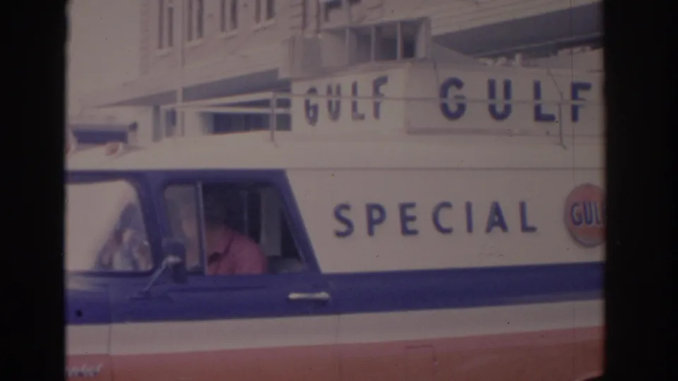 Gulf Special Events vehicle fills the frame on a Florida street, with large Gulf lettering and a driver visible through the window.