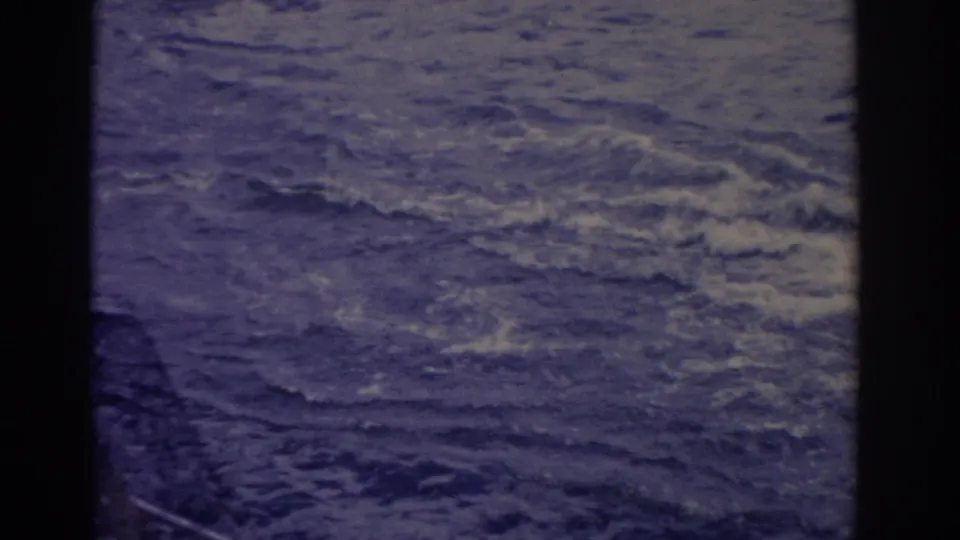 1962 Florida home-movie frame showing open water, disturbed wake, and no clear skiers in the final contact-sheet panel.