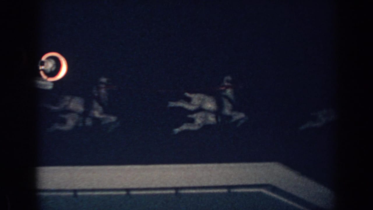 Santa sleigh and reindeer figures stretch across a dark rooftop scene.