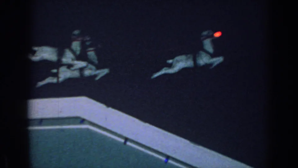 A red-nosed lead reindeer decoration appears near the roof edge in the 1962 Gary, Indiana nighttime footage.