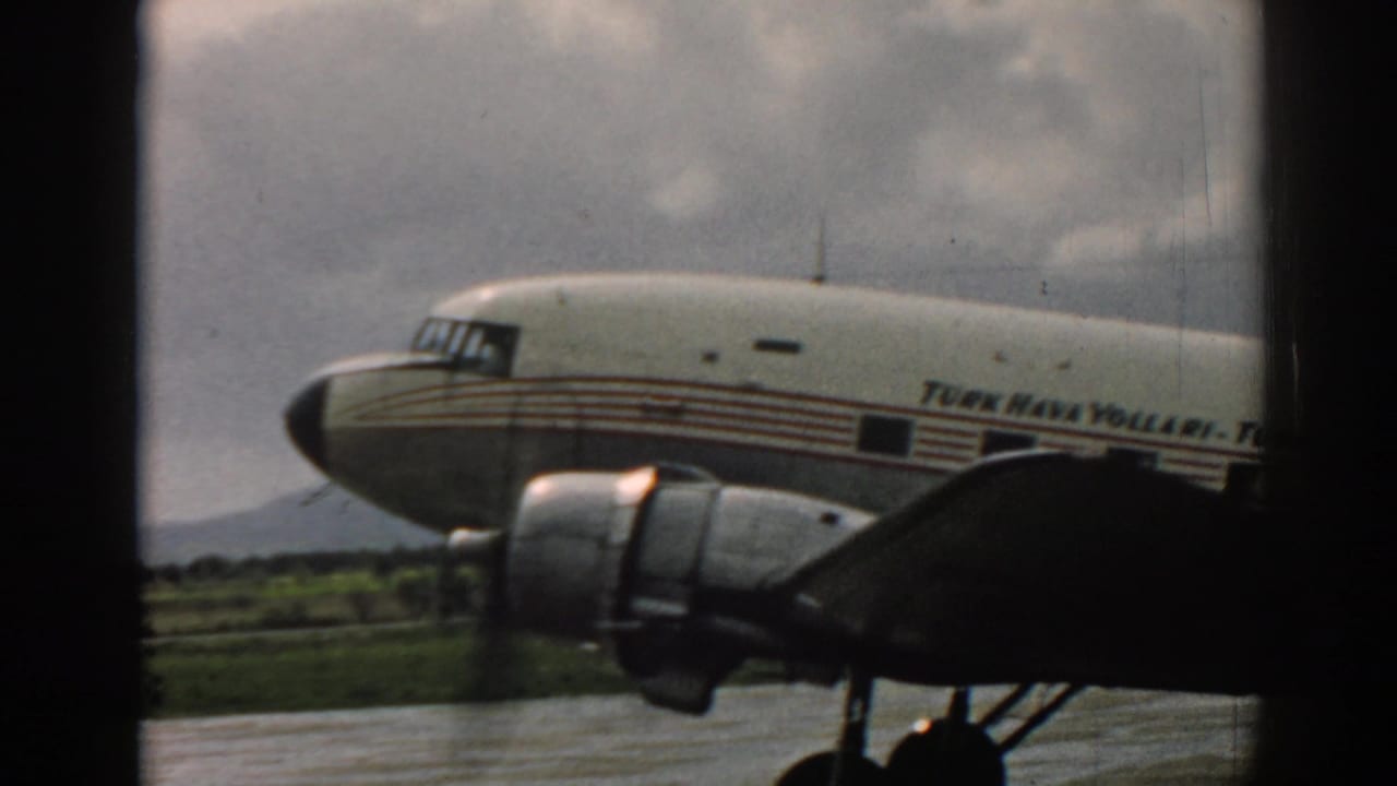 Side view of the 1962 Izmir propeller airliner, with striped fuselage, TURK HAVA YOLLARI lettering, engine, and wing visible.