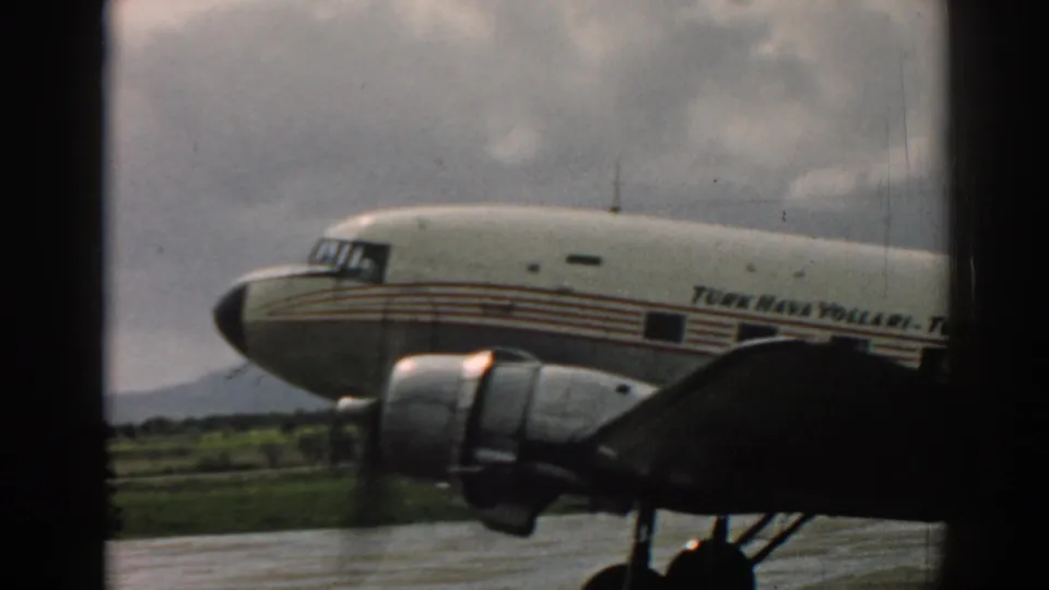 Side view of the 1962 Izmir propeller airliner, with striped fuselage, TURK HAVA YOLLARI lettering, engine, and wing visible.