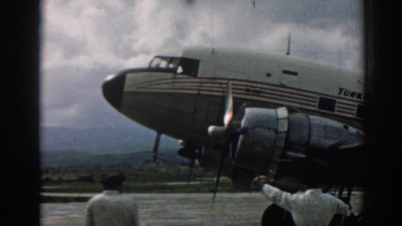 1962 Izmir airport footage showing a Turkish Airlines propeller aircraft with workers near the nose and engine area.