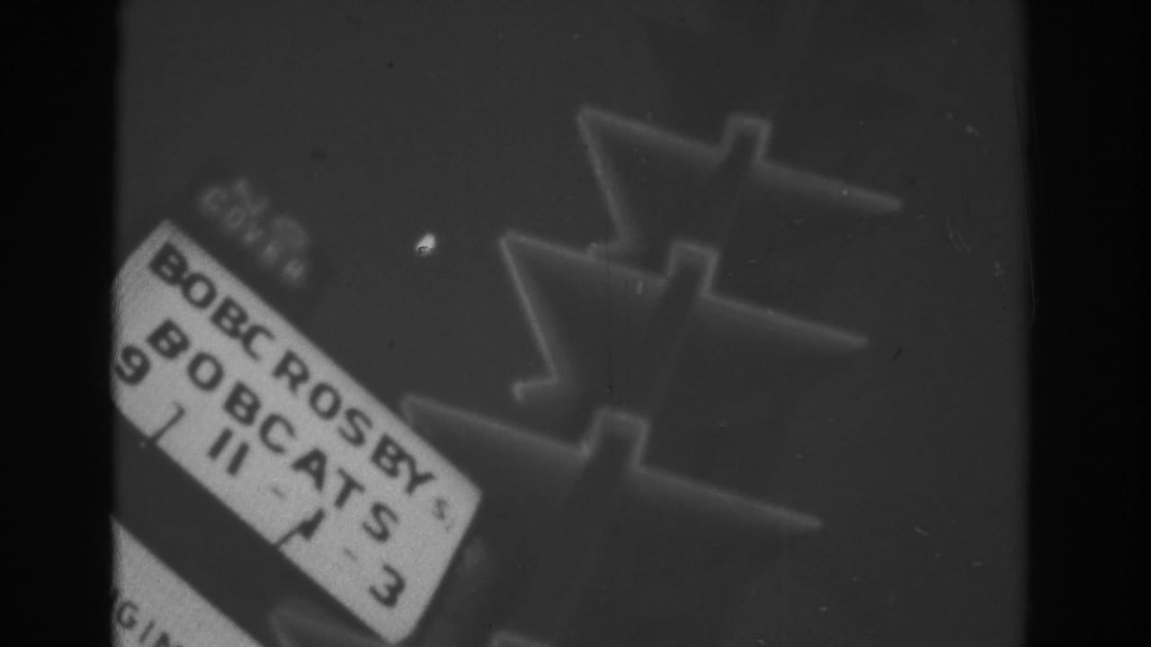 1962 Las Vegas home-movie frame showing a soft-focus portion of an outdoor entertainment marquee with Bob Crosby and Bobcats text.