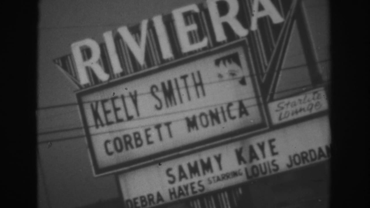 Angled close-up of the Riviera Hotel marquee with 1962 performer names visible on grainy 8mm footage.