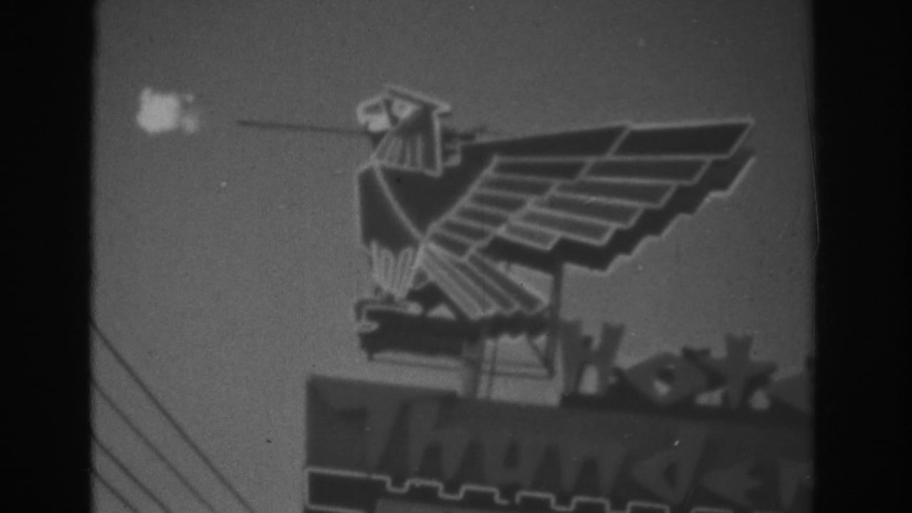 Las Vegas Riviera sign detail with an eagle-like emblem above partial building or sign lettering in 8mm footage.