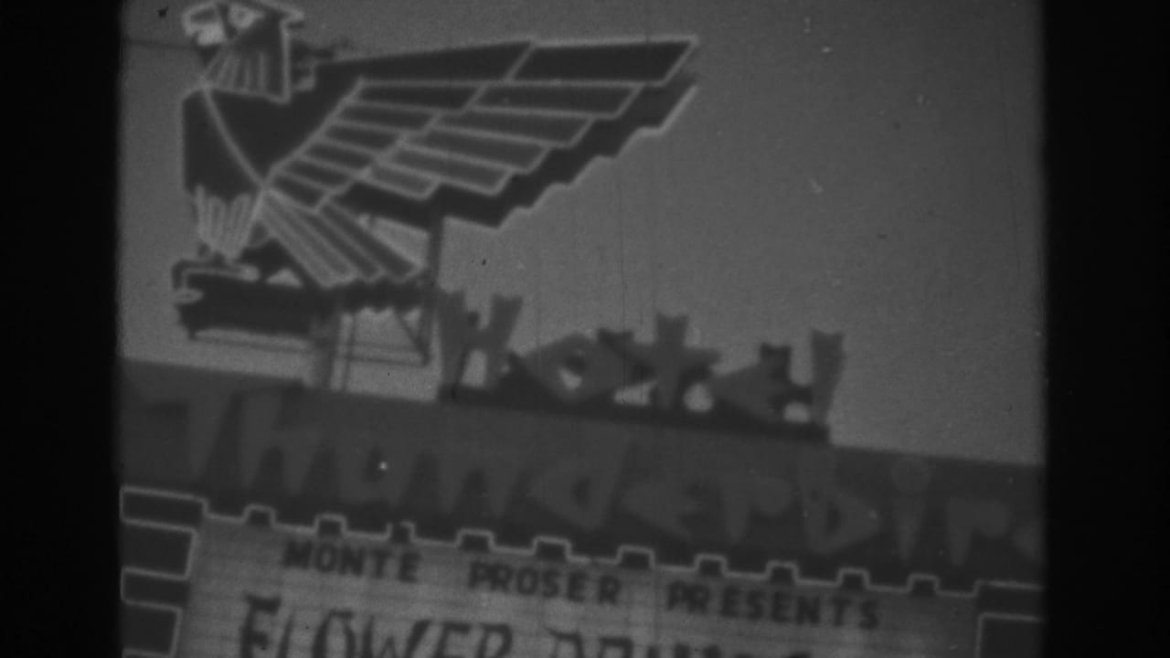 Thunderbird Hotel sign with eagle emblem and partial marquee text.