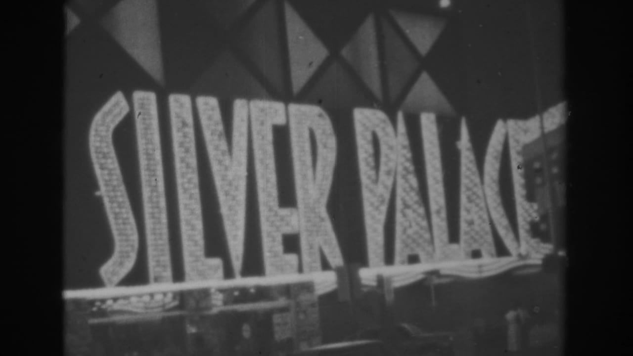 1962 Las Vegas home-movie frame showing the SILVER PALACE sign lit against a dark facade.