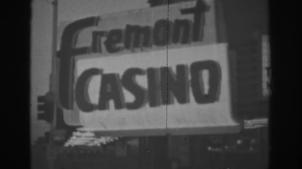 1962 Las Vegas 8mm frame with a slightly angled view of the Fremont Casino marquee and bright sign face.