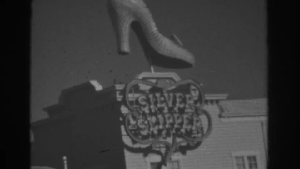 1962 Las Vegas 8mm frame with the Silver Slipper sign and large shoe ornament filling most of the view.