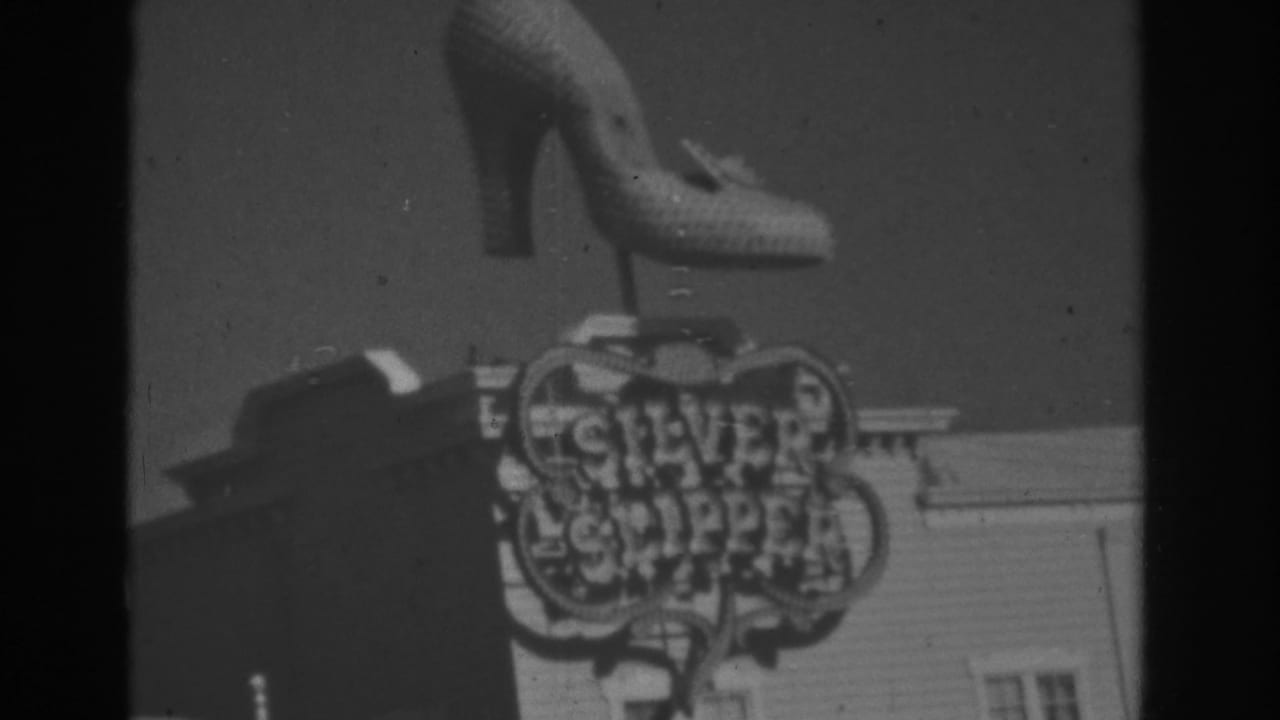 Shoe-shaped sign above Silver Slipper lettering on a building.
