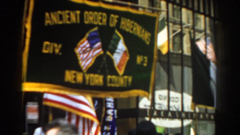 Green Ancient Order of Hibernians Division No. 3 New York County banner appears above an American flag in the 1962 New York City parade.