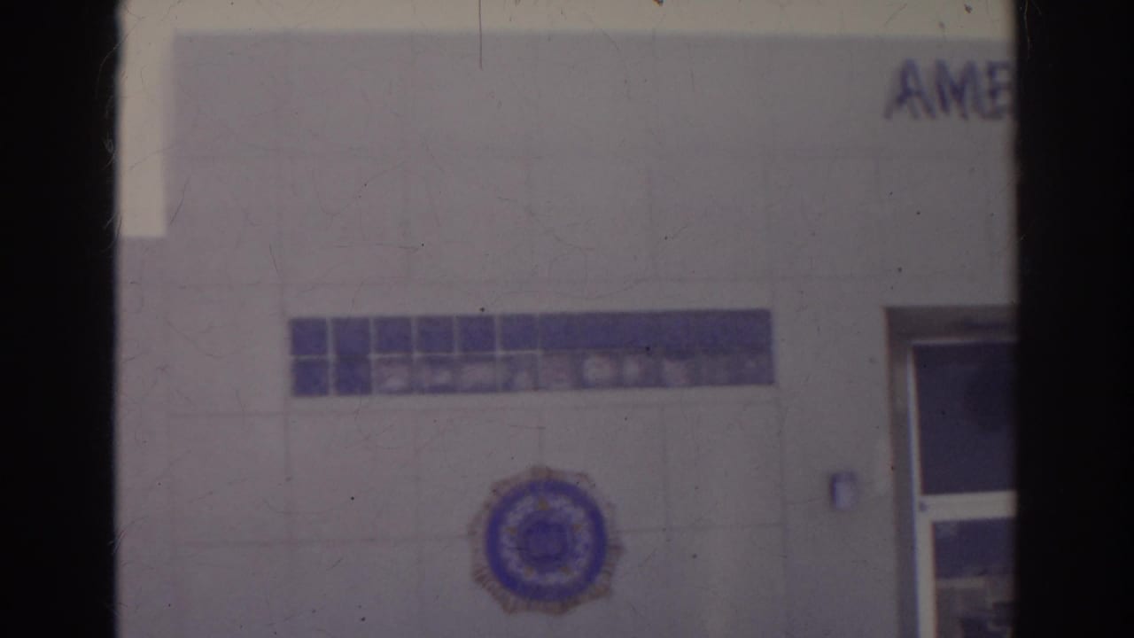 1966 Norfolk frame of the American Legion building exterior, with the emblem visible and partial signage near the top edge.