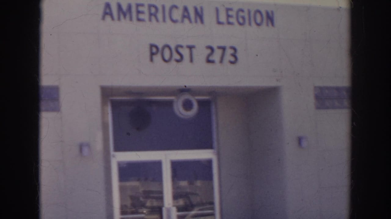 1966 Norfolk frame showing the American Legion Post 273 entrance, glass doors, and partial wall signage.
