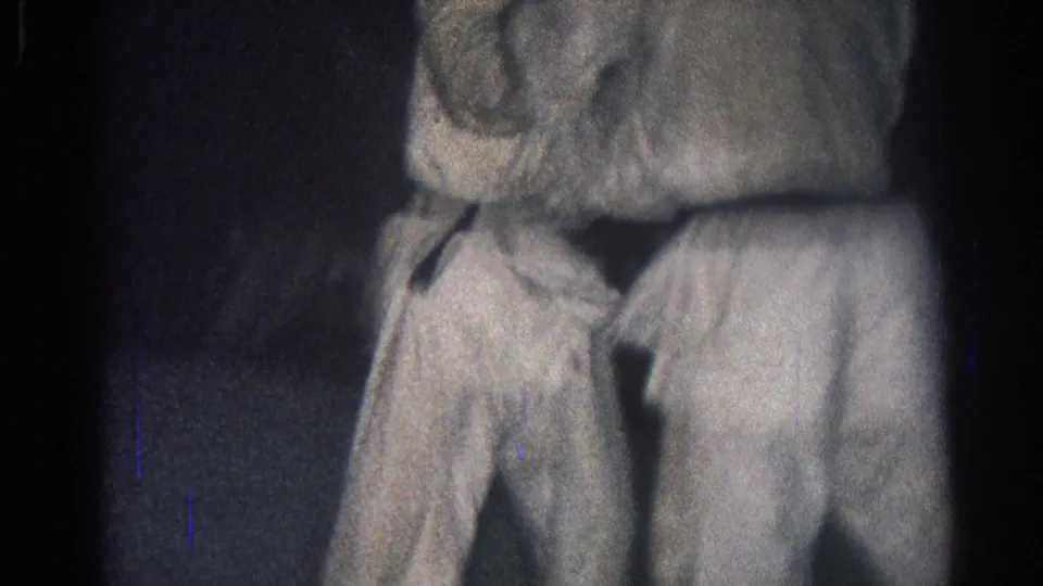 San Gabriel, California 1966 frame showing two men in white martial arts-style uniforms close together in a hold on the mat.