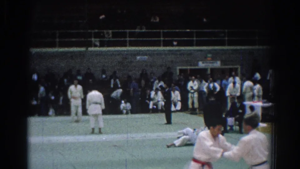 A wider 1966 San Gabriel competition view shows judo participants in white gi, one competitor on the mat, and spectators along the wall.